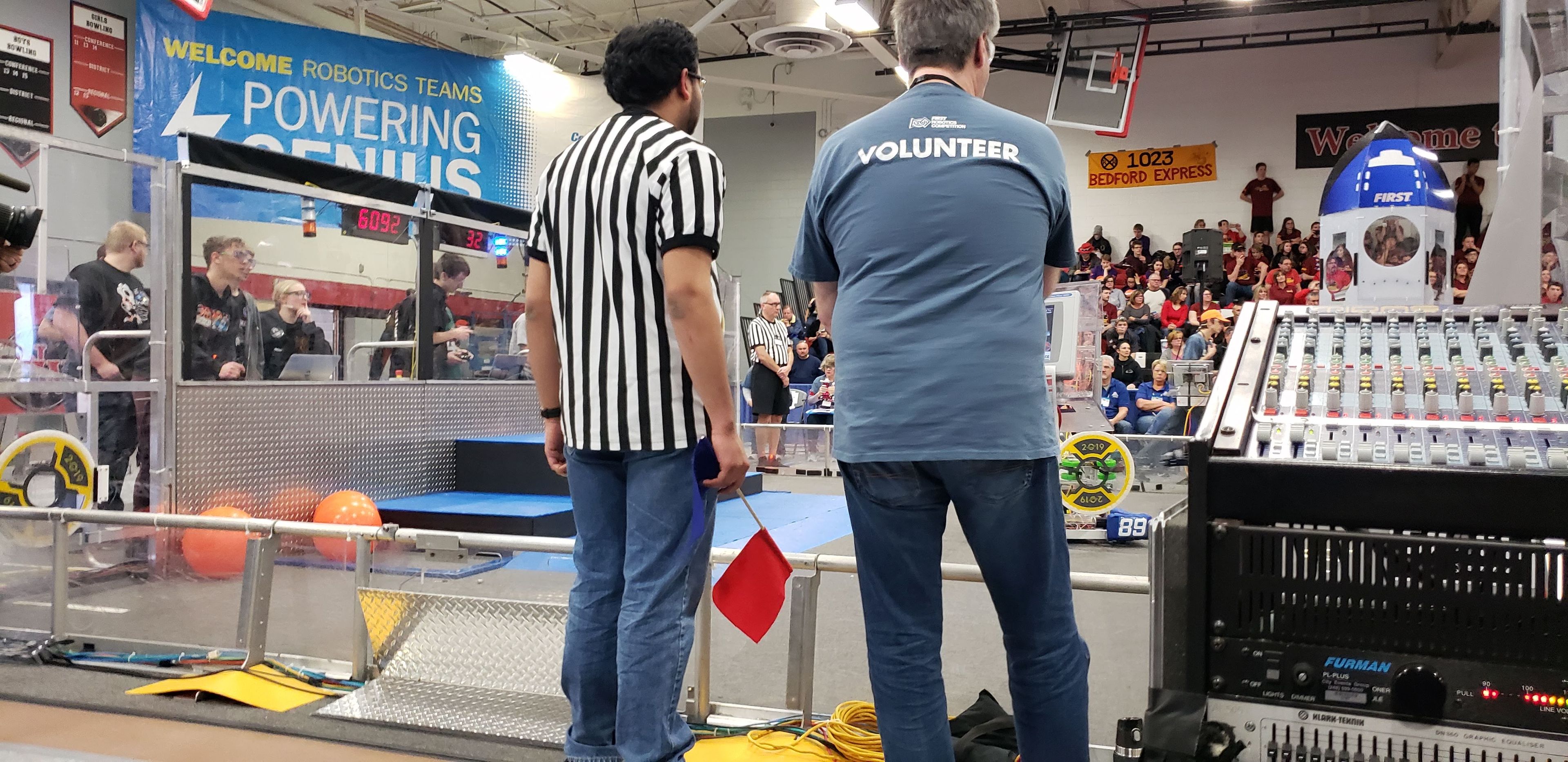 A FAMNM member volunteers as a referee at an offseason FRC competition in 2019